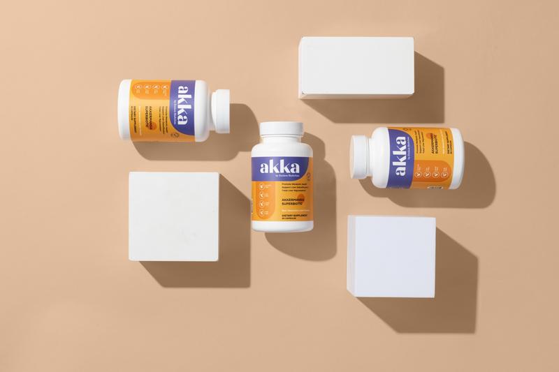 Akka Akkermansia Superbiotic bottles arranged in a flat lay showing the label