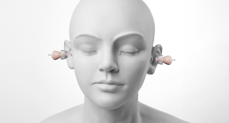 Illustration of how the Audien Atom 2 hearing aids sit in both ears