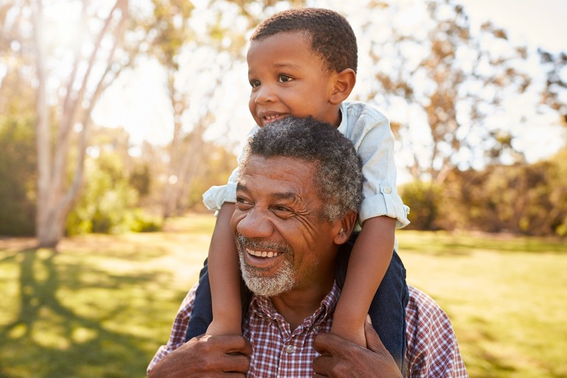 Older man outdoors with his grandson, the everyday setting the Audien Atom 2 is designed for