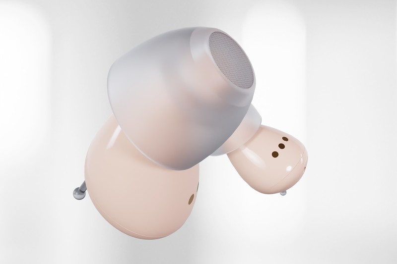 Pair of Audien Atom 2 hearing aids showing the dome tips and control buttons