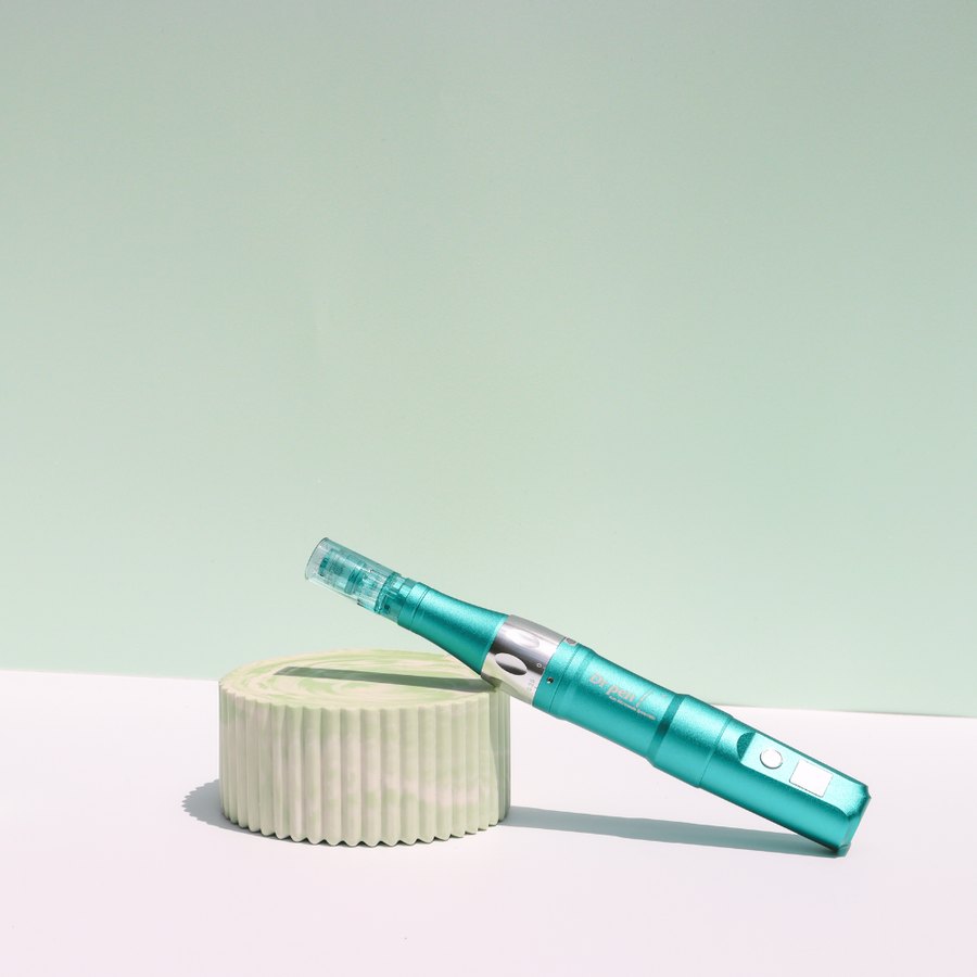 The Dr. Pen Ultima A6S microneedling pen in teal with a needle cartridge attached