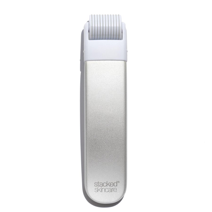 The StackedSkincare microneedling face roller tool with a silver handle