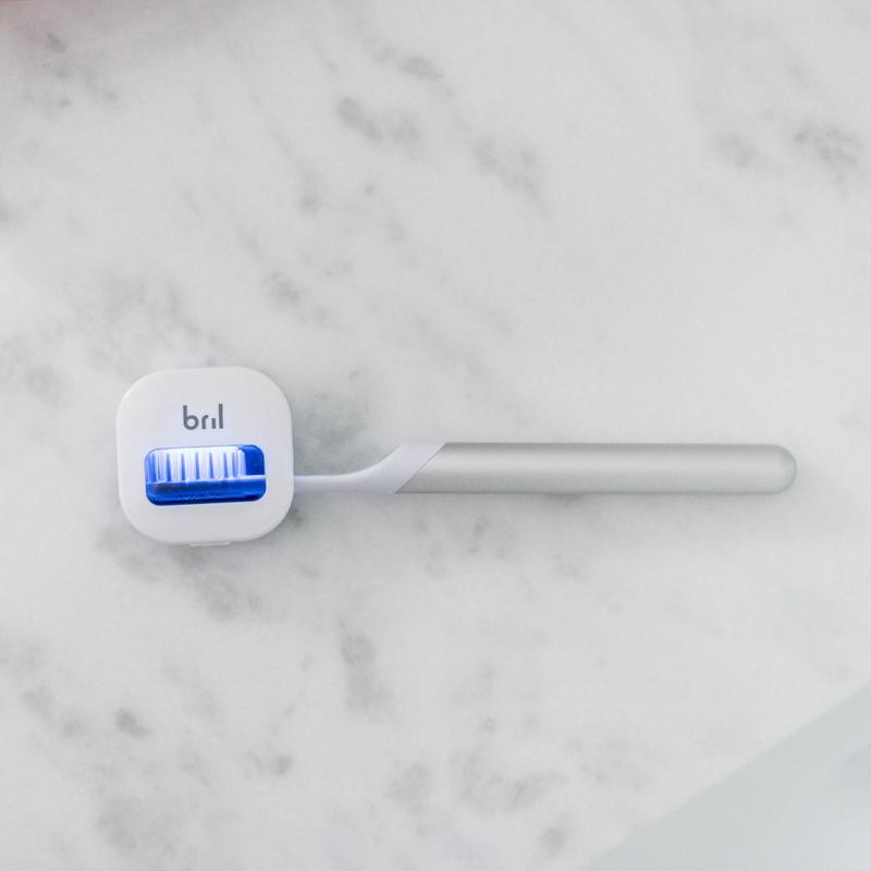 Bril UV-C toothbrush sanitizer magnetically mounted on a bathroom mirror