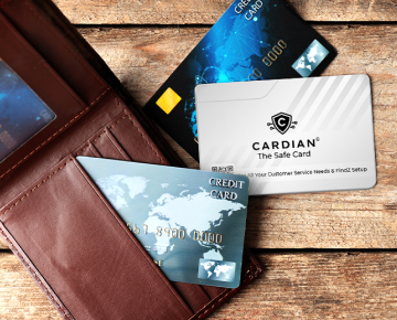 Cardian The Safe Card resting on a table beside a wallet and credit cards