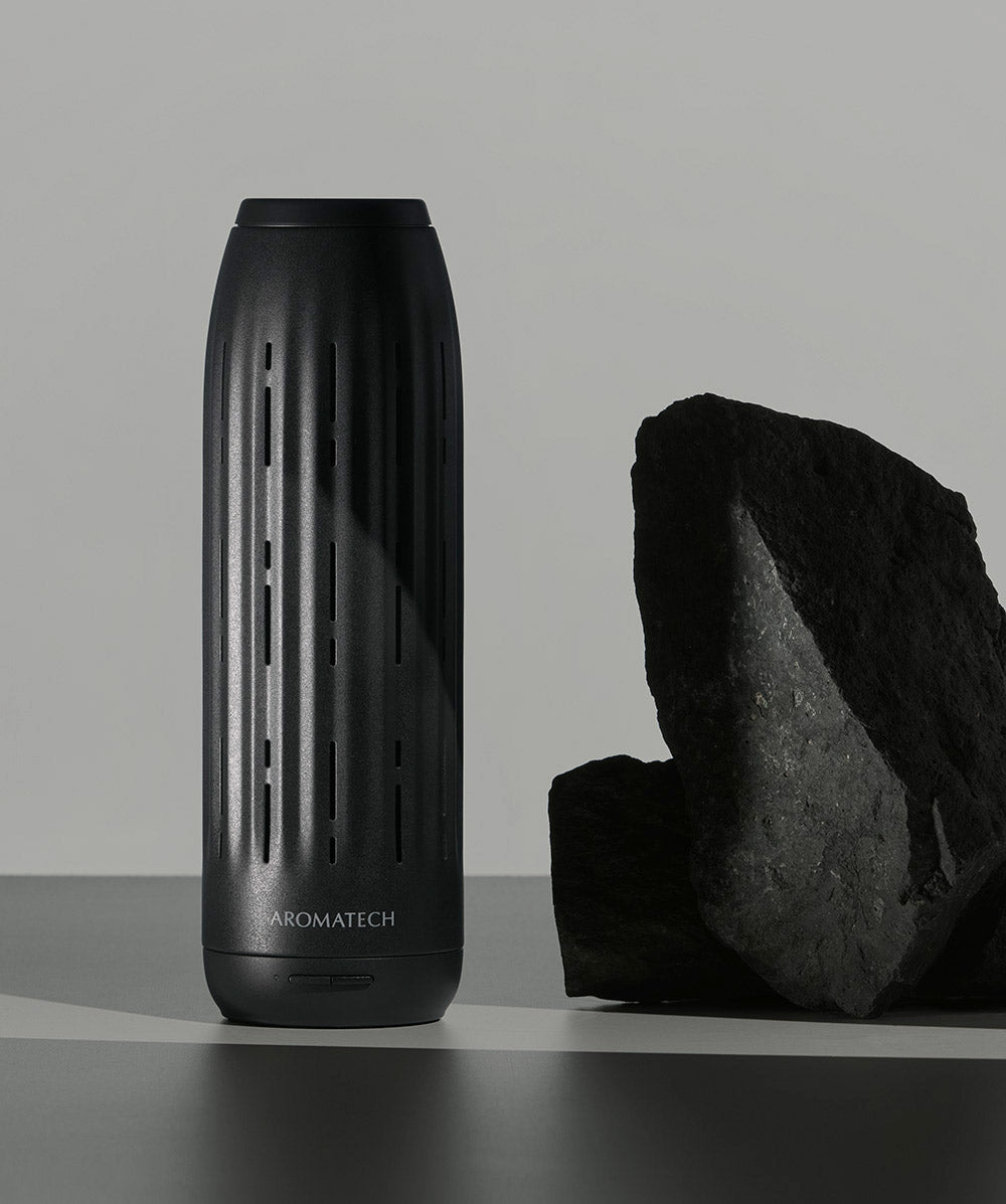 AromaTech Ambience nebulizing diffuser, a matte black cylinder