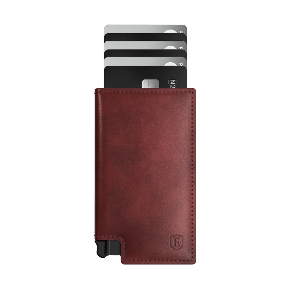 The Ekster Parliament wallet in merlot leather with cards fanned out of the aluminum cardholder