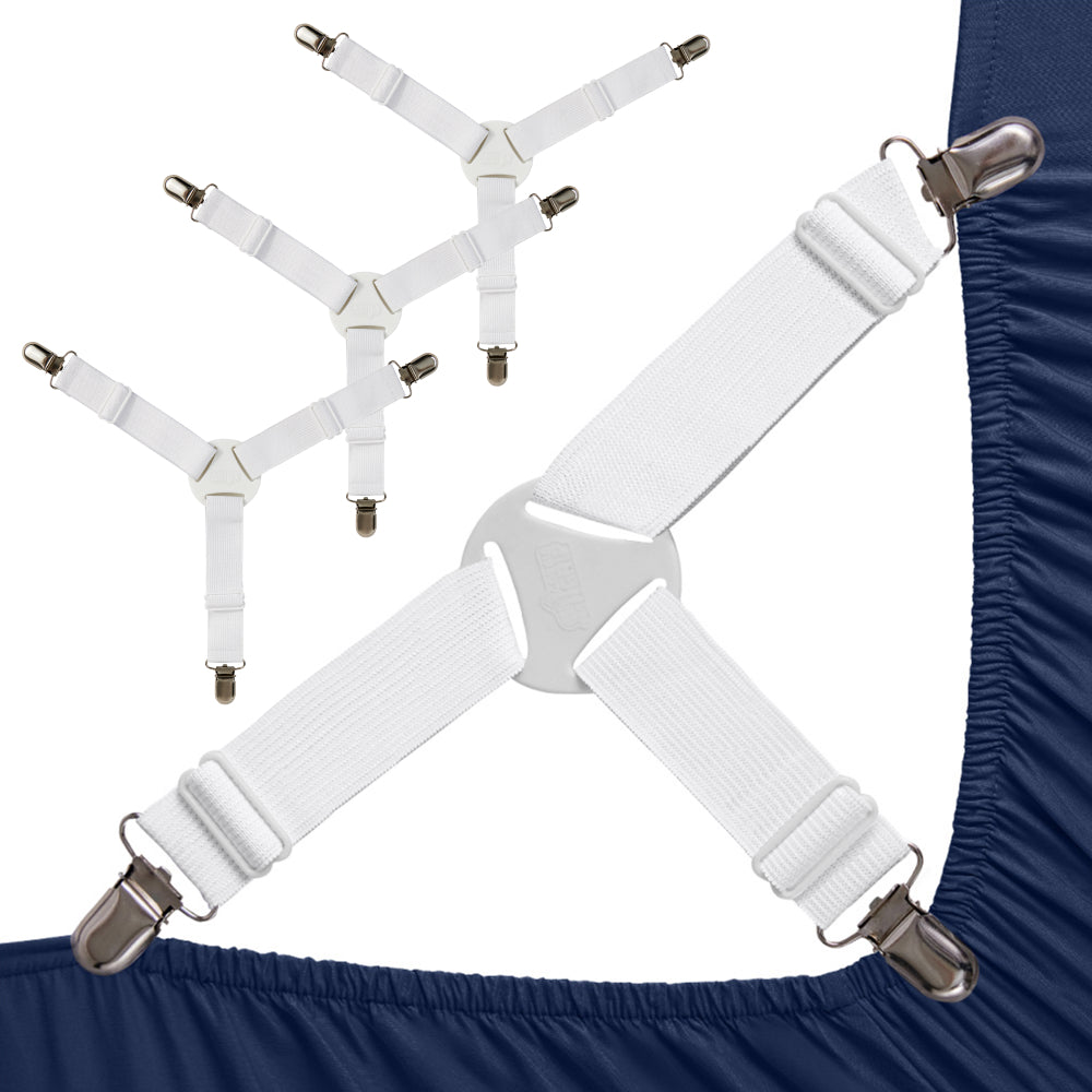 White Gorilla Grip crisscross suspender straps with metal clips holding a navy fitted-sheet corner