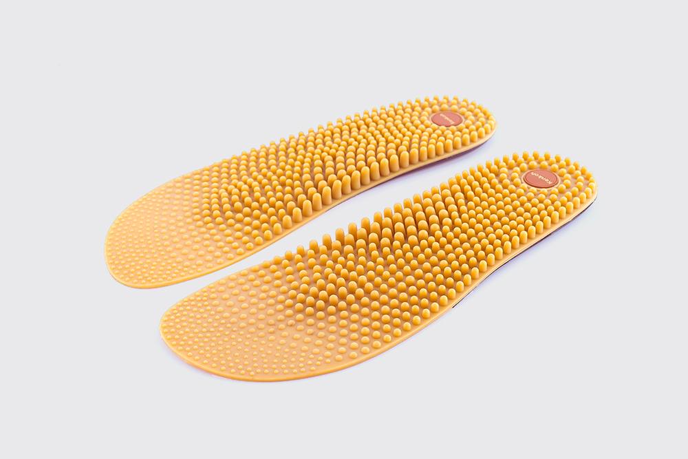 Kenkoh natural-rubber massage insoles covered in raised reflexology nodules