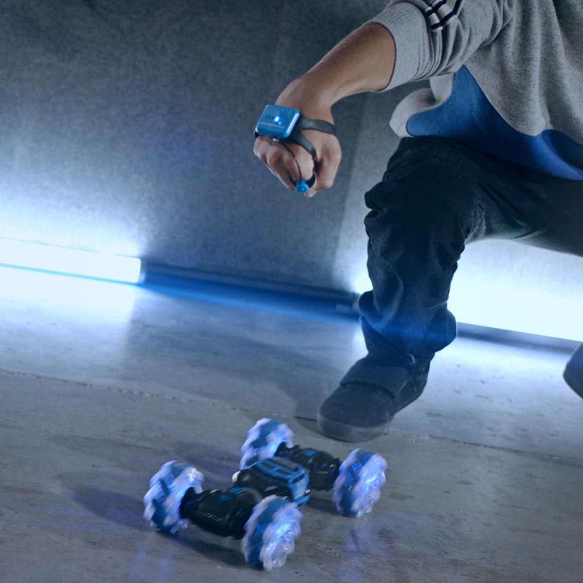 Sharper Image gesture sensing RC stunt car being controlled by a motion wristband