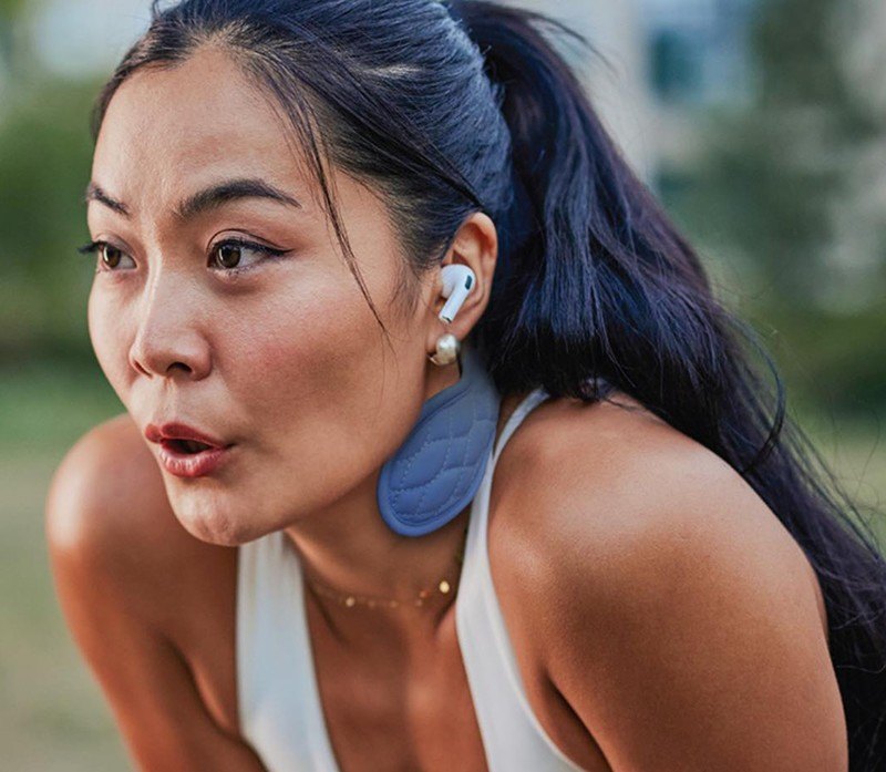 Person wearing the Cool Cura cold-therapy neckband while active outdoors