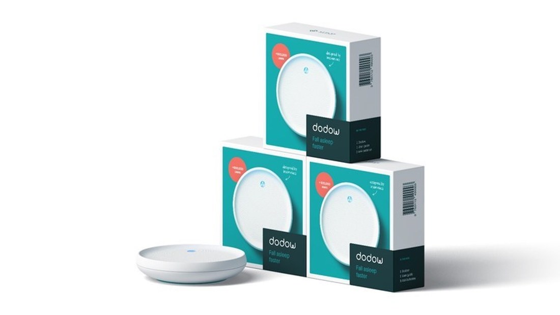 The Dodow sleep device shown next to its retail packaging