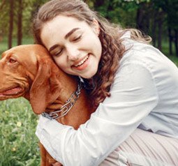 Owner outdoors with her dog, the audience for Dr. Rover Tick Off spray