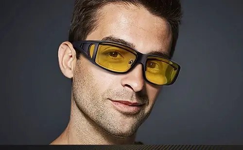 Man wearing Drive Bright fit-over night driving glasses over his regular prescription glasses