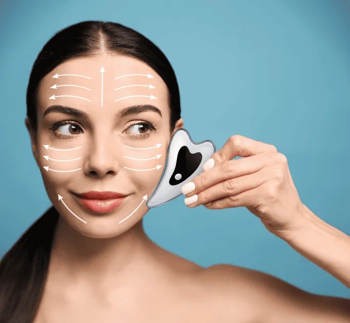 A model demonstrating the upward and outward strokes used with the Glokore electric gua sha