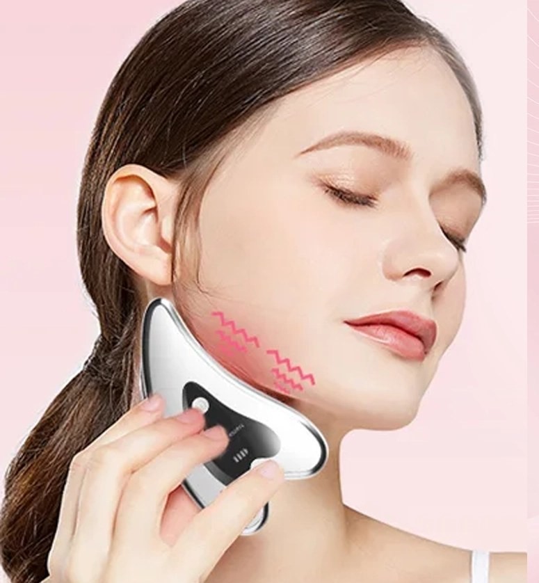 A model using the Glokore electric gua sha along the jaw and neck