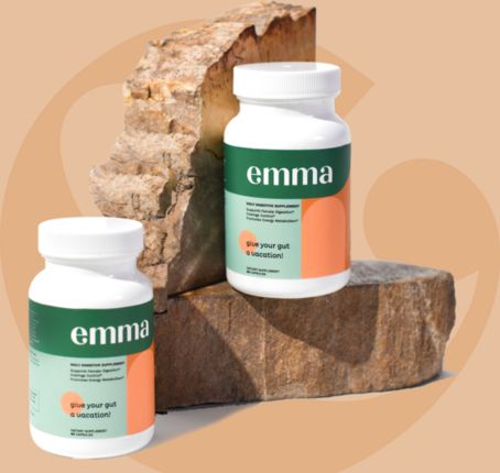 Two bottles of Emma Relief digestive supplement on a stone display