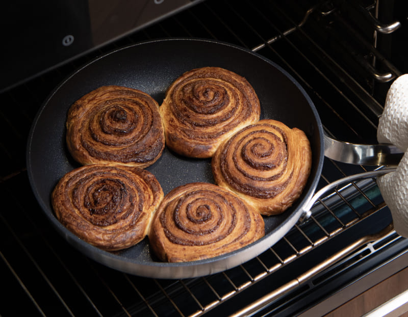Cinnamon rolls baked in the Emura non-stick pan inside an oven
