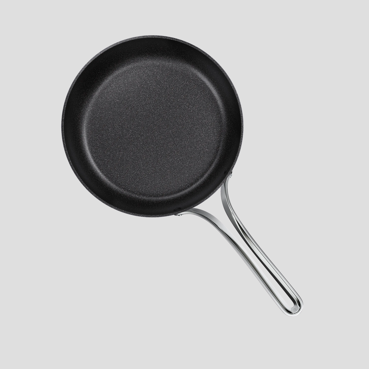 Top-down view of the Emura non-stick frying pan showing the speckled PEEK coating and stainless steel handle