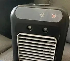 Close-up of the Glacier Breeze personal cooler controls and top handle