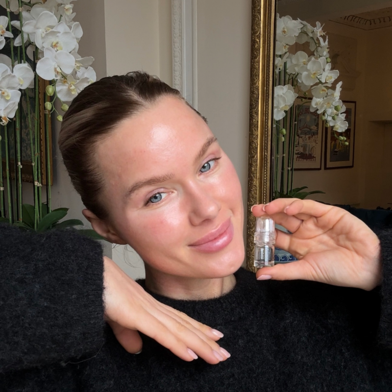 Person holding a Glamory micro-infusion serum vial at home