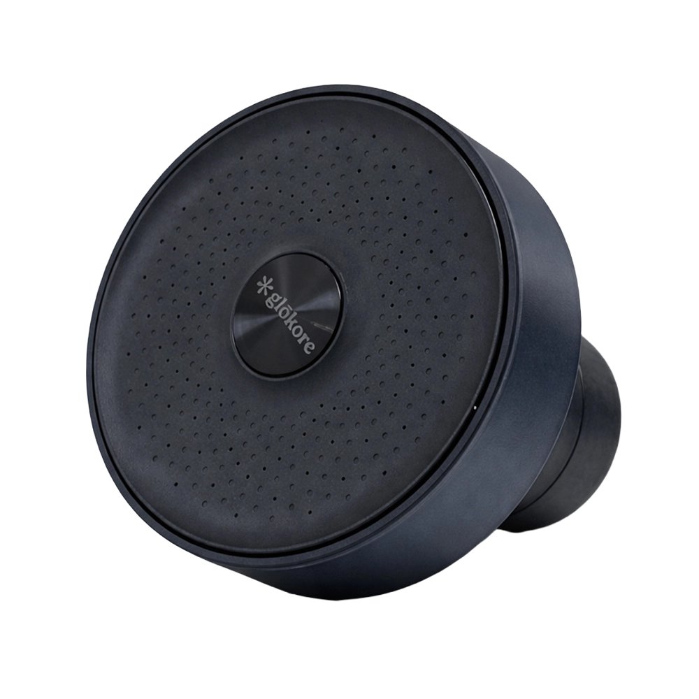 The Glokore Filtered Showerhead, a round dark showerhead with a perforated face and center button