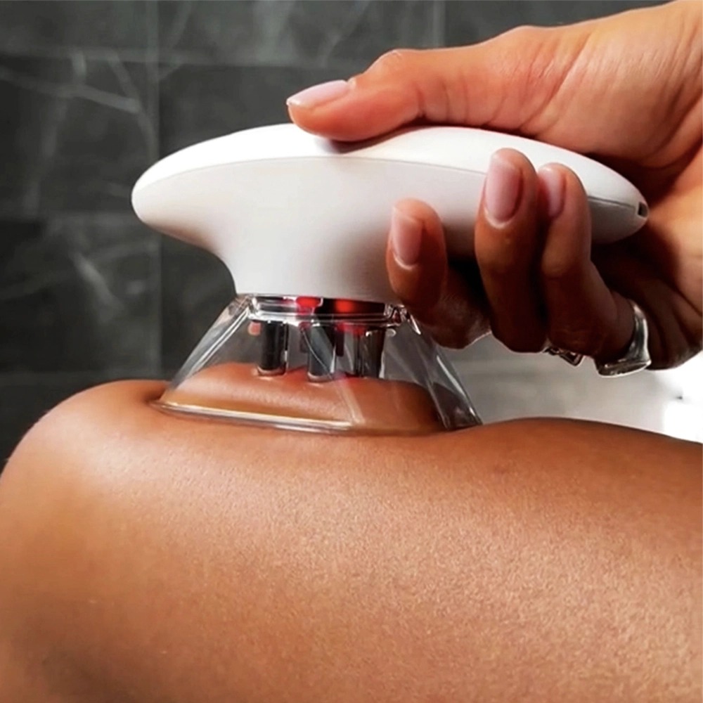Close-up of the Glokore IPL Body Sculptor cup head gliding over skin