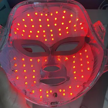 Close-up of the lit red LED array inside the Glokore LED mask