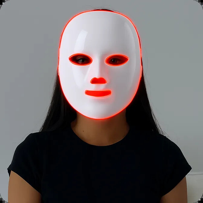 Person wearing the Glokore LED face mask lit up in red light
