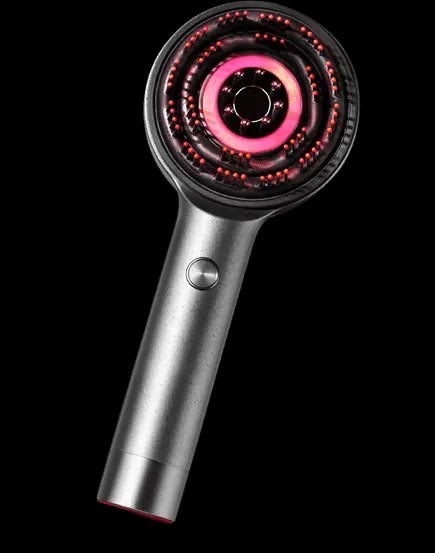 Glokore Scalp Massager handheld showing the red-light massage head and metal handle