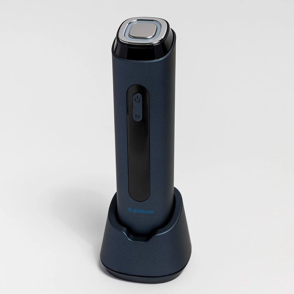 Glokore Transformer Wand standing upright in its charging base
