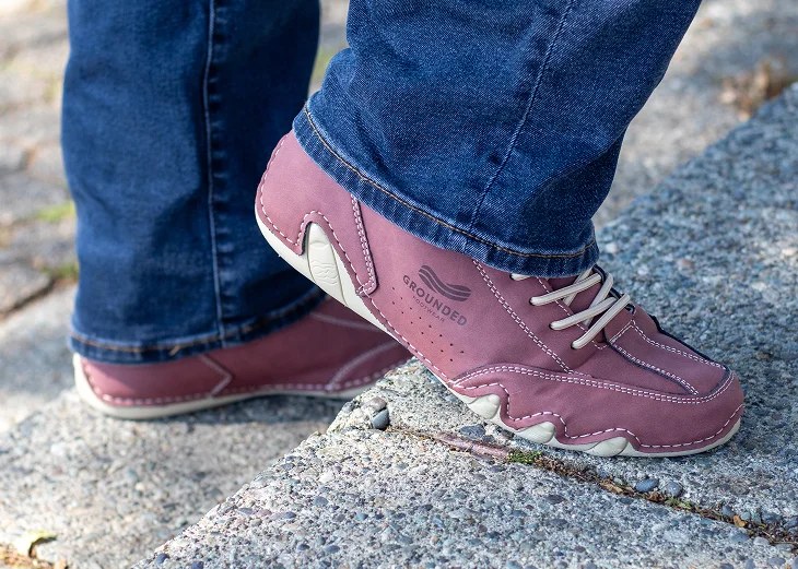 The Grounded Footwear Evolve barefoot shoe worn outdoors, showing the wide forefoot