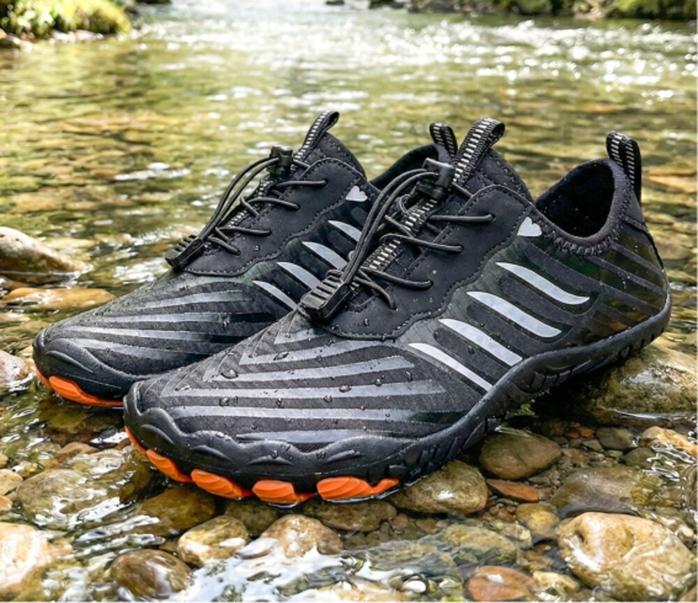 Grounded Footwear barefoot shoes on river rocks showing the wide toe box and flexible sole