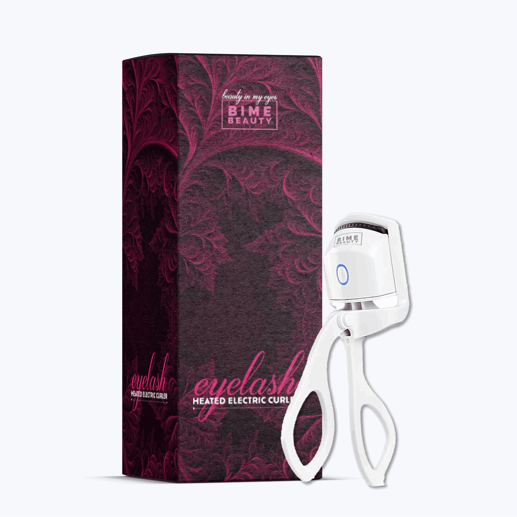 The white Bime Beauty Heated Eyelash Curler standing beside its retail box