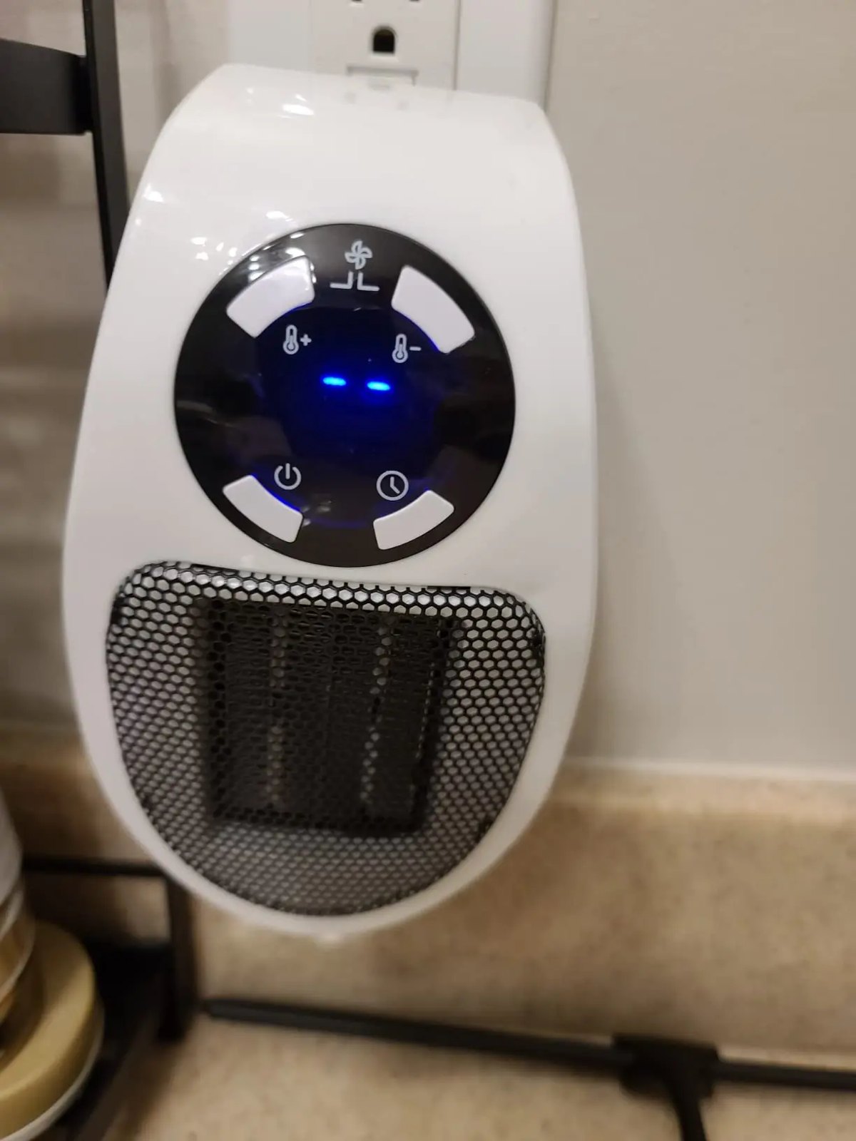 HeatSpace plug-in ceramic heater with its blue digital display showing the set temperature