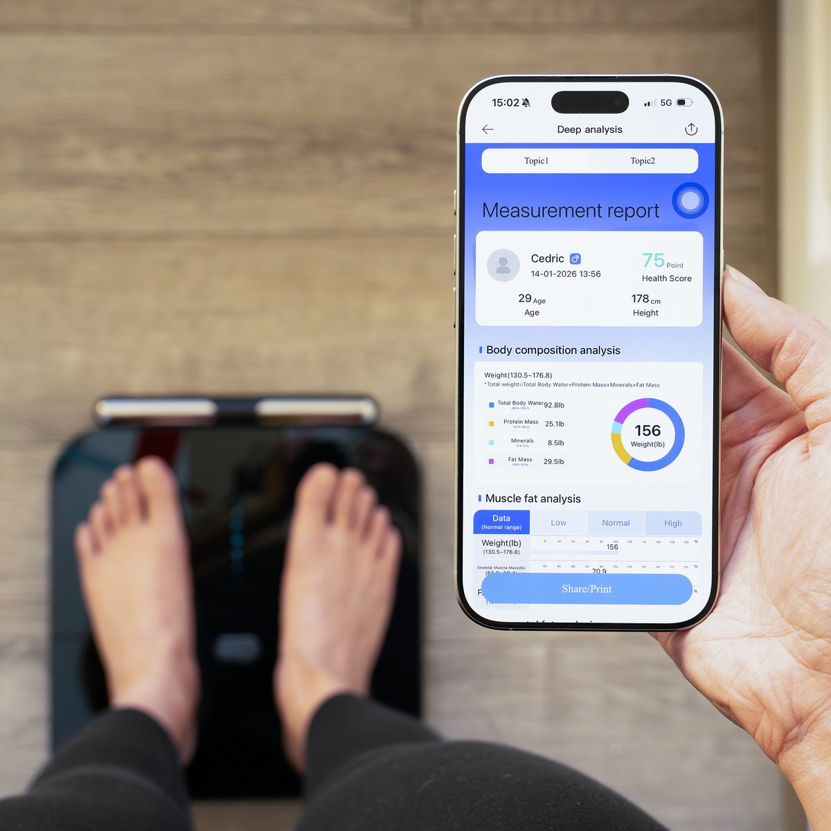 A person standing on the Herz P1 Smart Scale while viewing the app's body-composition report showing body water, protein, minerals and fat mass