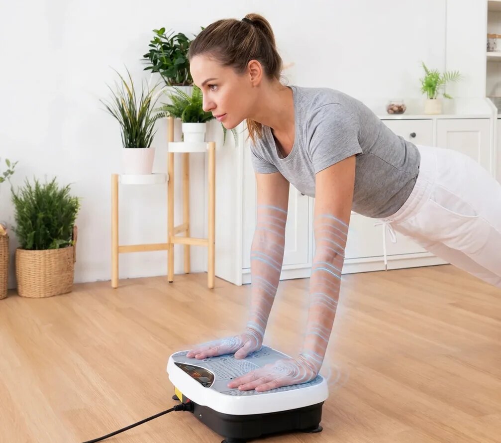 A person holding a plank with hands on the Herz P1 vibration plate