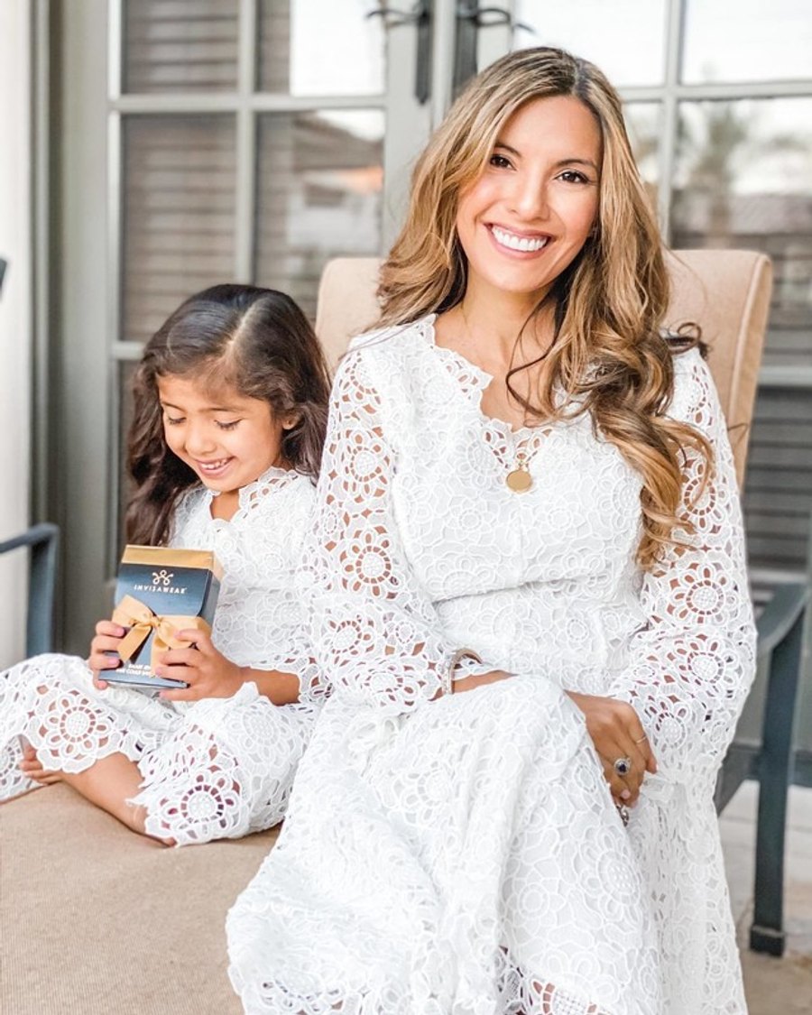A person wearing the invisaWear smart pendant necklace out in daily life