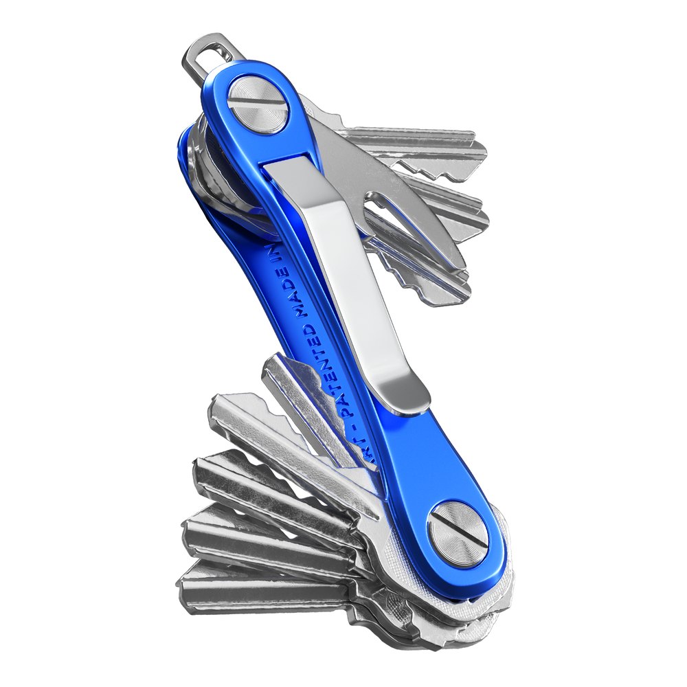 A KeySmart key organizer fanned open with keys alongside its stainless steel bottle-opener accessory