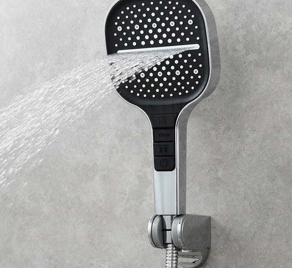 Loft Home Essentials showerhead docked in its chrome wall bracket with the hose attached