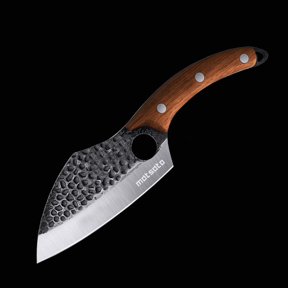 Matsato chef knife with its hammered blade, finger hole and wood handle