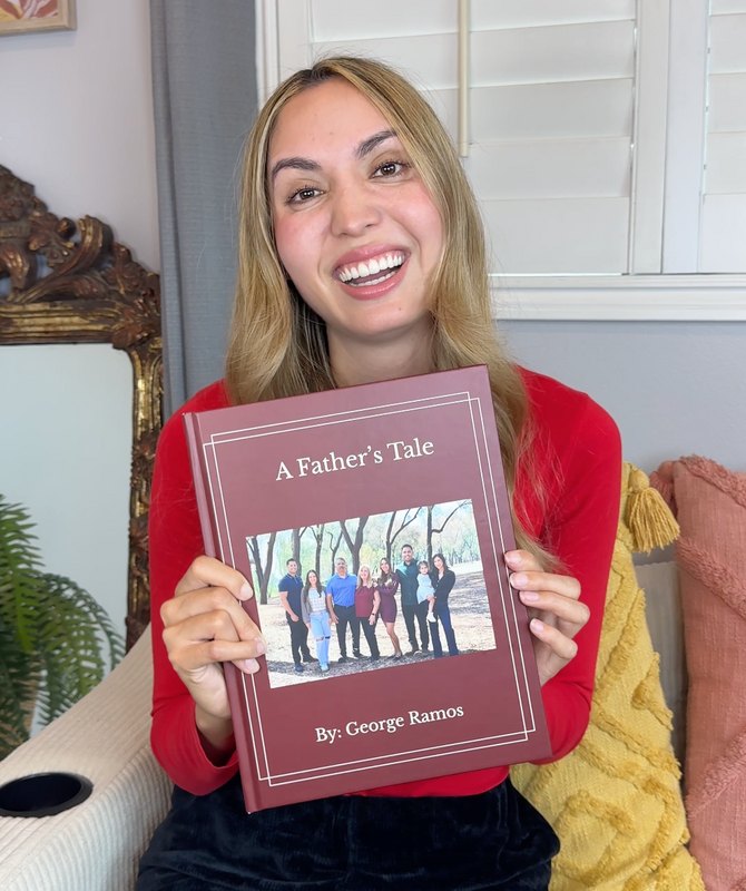 Person holding a Memorygram 'A Father's Tale' hardcover legacy book