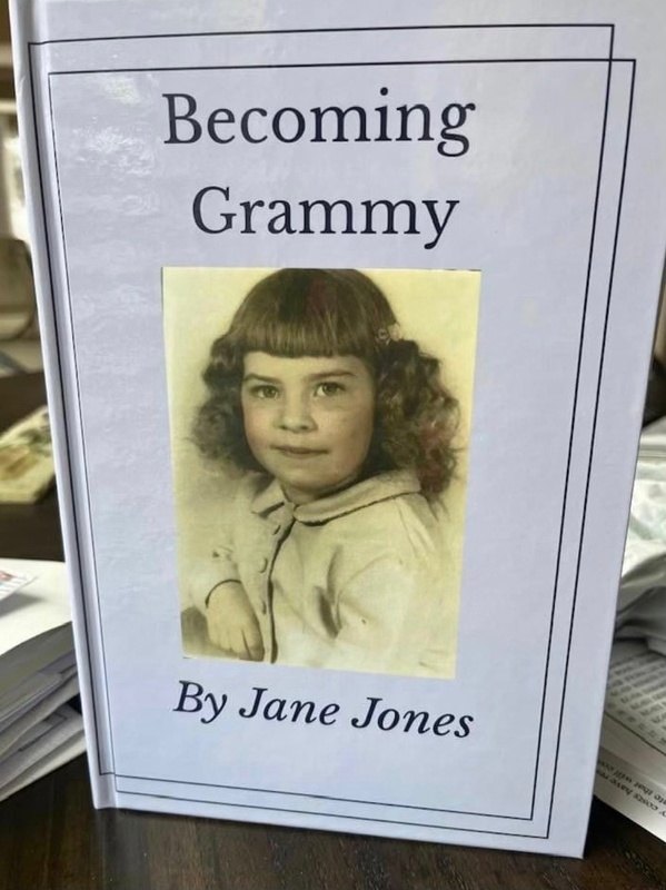 Cream Memorygram 'Becoming Grammy' legacy book with a vintage childhood photo