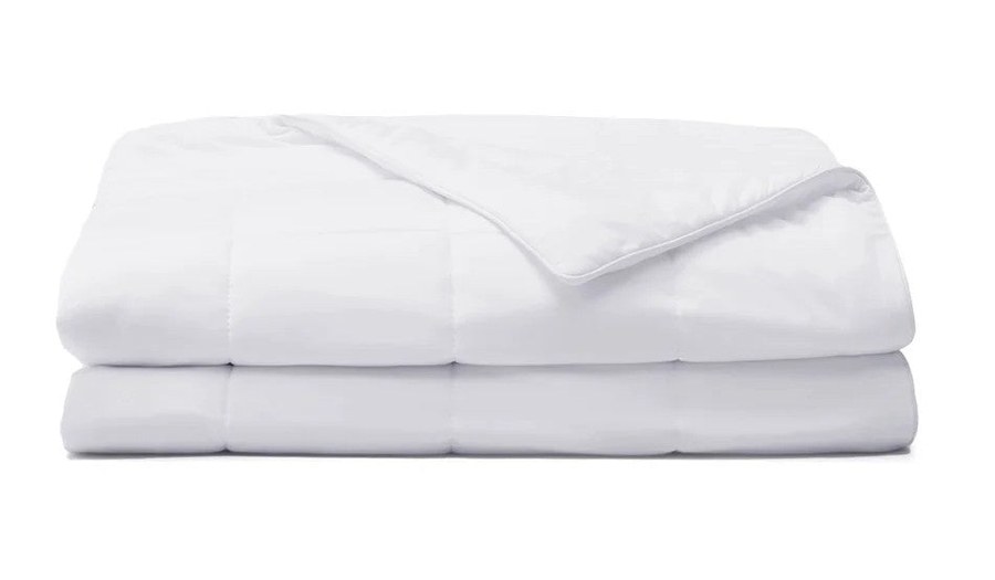Miracle cooling comforter folded with the corner turned back