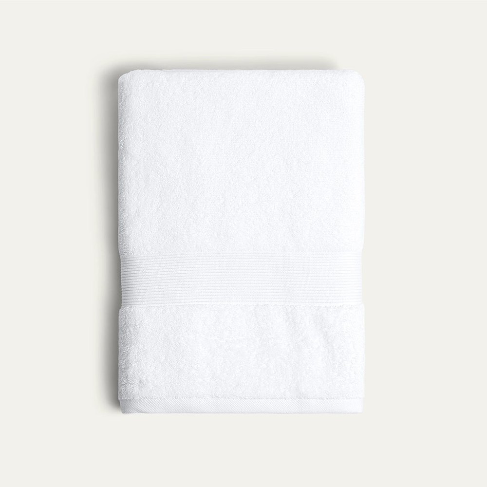 A folded white Miracle silver-infused bath towel
