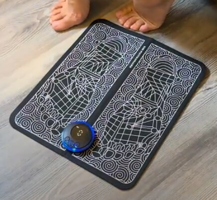 The Nooro Foot Massager EMS mat folded on the floor