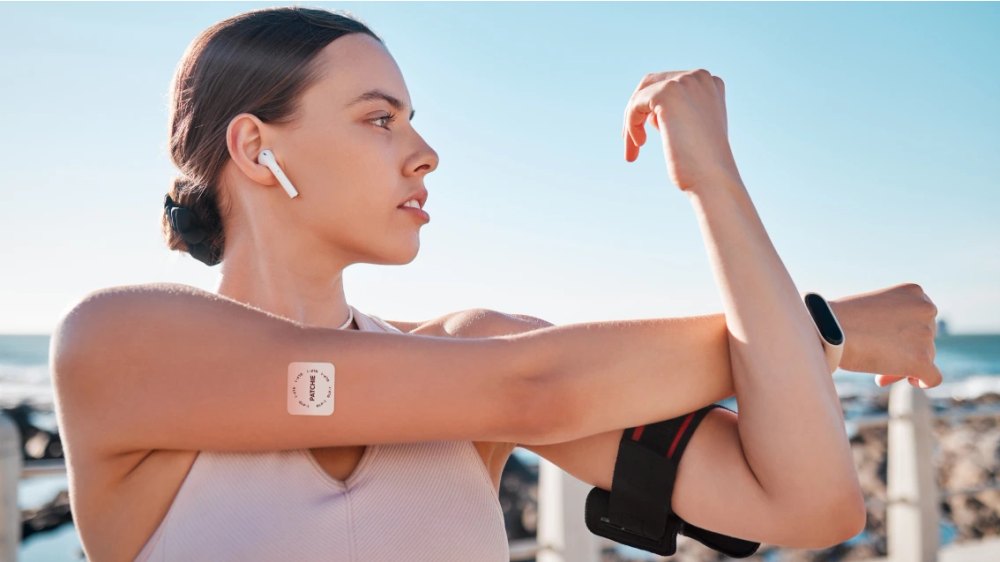 A person wearing a Patchie patch on the upper arm during a workout