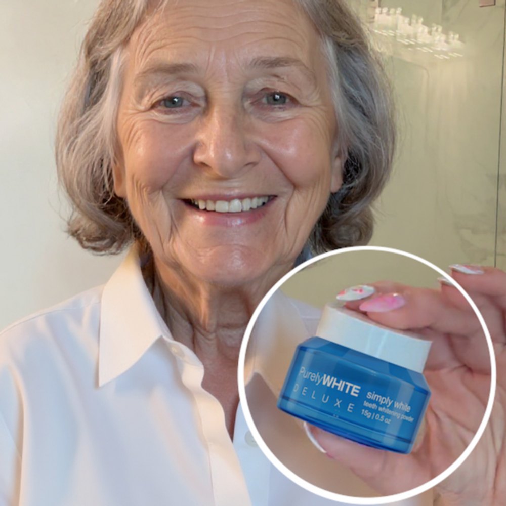 A customer holding the blue PurelyWHITE Deluxe powder jar