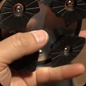 Close-up of the Ready Walker cane's pivoting multi-foot all-terrain base
