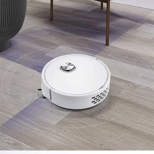 The RoboVac X robot vacuum moving across a hardwood floor around furniture legs