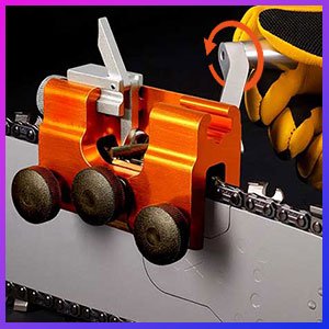 Gloved hand turning the Sherem saw sharpener while the chain is drawn past its carbide wheels